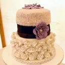 3 tier wedding cake decorated with flowers