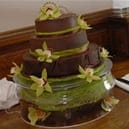 Chocolate wedding cake decorated with lillies